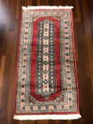 An Iranian rug, 160 cm x 80 cm.