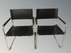 A pair of Scandinavian chrome and black vinyl armchairs
