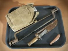 A military canteen, two triangular socket bayonets, a knife in sheath and a folding knife.