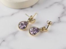 A pair of amethyst ear studs,