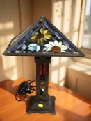 A Tiffany style metal and stained glass table lamp, height 51 cm.
