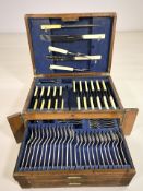 An oak cased canteen of EPNS and stainless steel cutlery, width 45 cm.