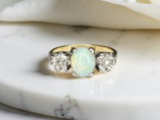 An antique 18ct gold opal and diamond ring, size J CONDITION REPORT: 3.
