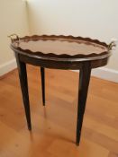 A mahogany tray table with brass twin handles, width 59 cm.