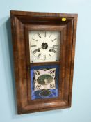 A 19th century continental walnut wall clock, height 66 cm.