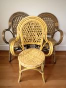 A set of three wicker armchairs and a further pair of bentwood and cane chairs.