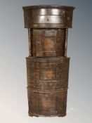 A 19th century continental stained beech corner cabinet,