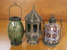 Three glass lanterns, tallest 37 cm.