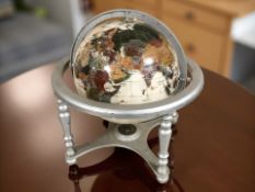 A gemstone globe, height 32 cm.