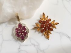 A ruby and diamond pendant in 9ct gold setting, and a fire opal pendant, one stone deficient,