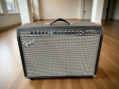 A Fender Champion 100 amplifier, with power lead, width 67 cm.
