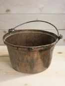 A copper pot with swing handle, diameter 38 cm.