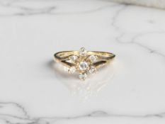 A 9ct gold diamond cluster ring, size L CONDITION REPORT: 1.