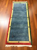 A polychrome woolen runner, 215 cm x 83 cm.