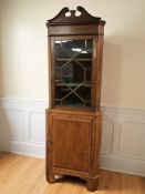 A 19th century inlaid mahogany corner cabinet, 197 cm high.