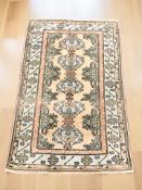 An Anatolian rug, 167 cm x 110 cm.