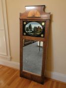 A 19th century continental inlaid mahogany and reverse painted glass mirror, 138 cm x 52 cm.