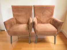 A pair of Scandinavian armchairs in peach fabric, width 61 cm.