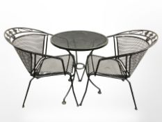 A contemporary metal patio table and two chairs