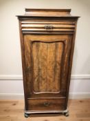 A late 19th century continental walnut single door cabinet,