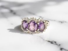 A 9ct gold amethyst and diamond ring, size L CONDITION REPORT: 3.