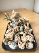 A group of Pendelfin rabbits and stands.