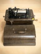 A Thomas Edison standard phonograph, in oak case, width 33 cm.