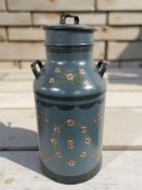 A painted metal milk churn, height 70 cm.
