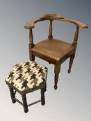 A carved oak corner armchair and a hexagonal beech footstool.