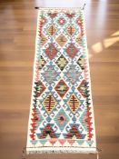 A Chobi Kilim runner, 154 cm x 53 cm.