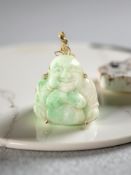A carved jade Buddha pendant, in 14ct gold, length 4cm CONDITION REPORT: 6.