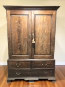 A Victorian mahogany and oak linen press, 130 cm x 62 cm x 193 cm.