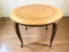 A continental walnut and beech circular breakfast table,