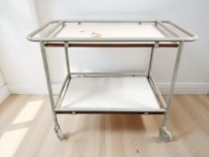 An enamelled metal and melamine two tier trolley,