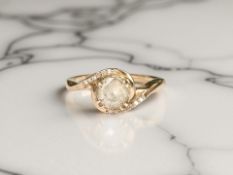 A 9ct gold crossover ring with diamond-set shoulders, size R CONDITION REPORT: 2.