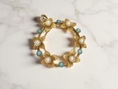 An early 20th century cultured pearl and turquoise wreath pendant, set in 15ct gold, diameter 25mm.