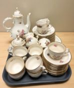 Forty pieces of KPM floral decorated tea china.
