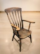 An elm kitchen armchair,