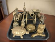 Brass items including two model cannons, horse and carriage model, other figures.