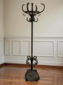 A wrought metal hat and coat stand