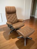 A Norwegian Stressless tan leather swivel lounge armchair and matching footstool.