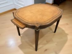 A reproduction mahogany and tooled leather occasional table with pullout slides, width 83 cm.