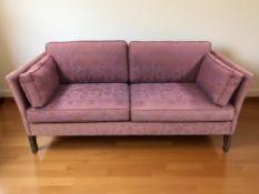 An Erik Jorgensen three seater settee, in purple floral fabric, width 170 cm.