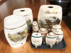 A group of ceramic liqueur barrels including three large examples, tallest 30 cm.