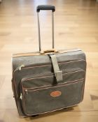 A Mulberry Mole Scotchgrain Rolling Suitcase, with chestnut leather trim, retractable handle,