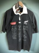 A Canterbury of New Zealand All Blacks t-shirt with various signatures, size M.