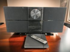 A Bang & Olufsen Beosound Century, with remote.