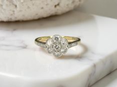An antique 18ct gold daisy cluster ring, size Q CONDITION REPORT: 2.