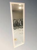 A cream rectangular floor standing mirror, 175 cm x 55 cm.