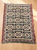 A hand stitched tasseled throw of caucasian design, 160 cm x 116 cm.